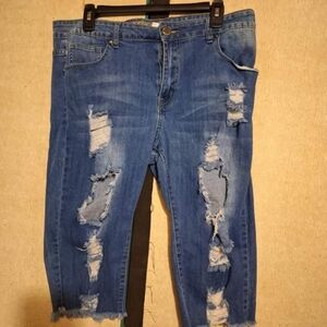 'VIP Jeans' to-the-knee, dark blue jeans shorts, medium. With ripped details.